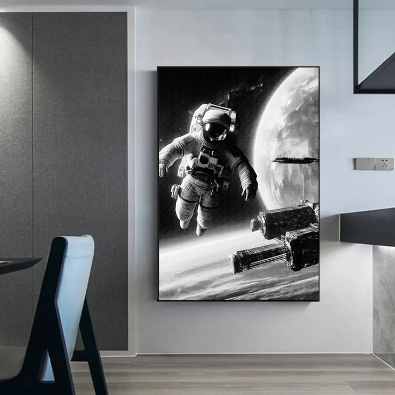 Canvas print of an astronaut in space with a space station and planet in the background, hanging on a wall.