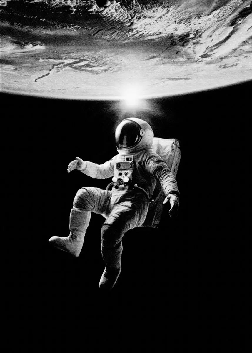 Black and white image of an astronaut in space with Earth in the background