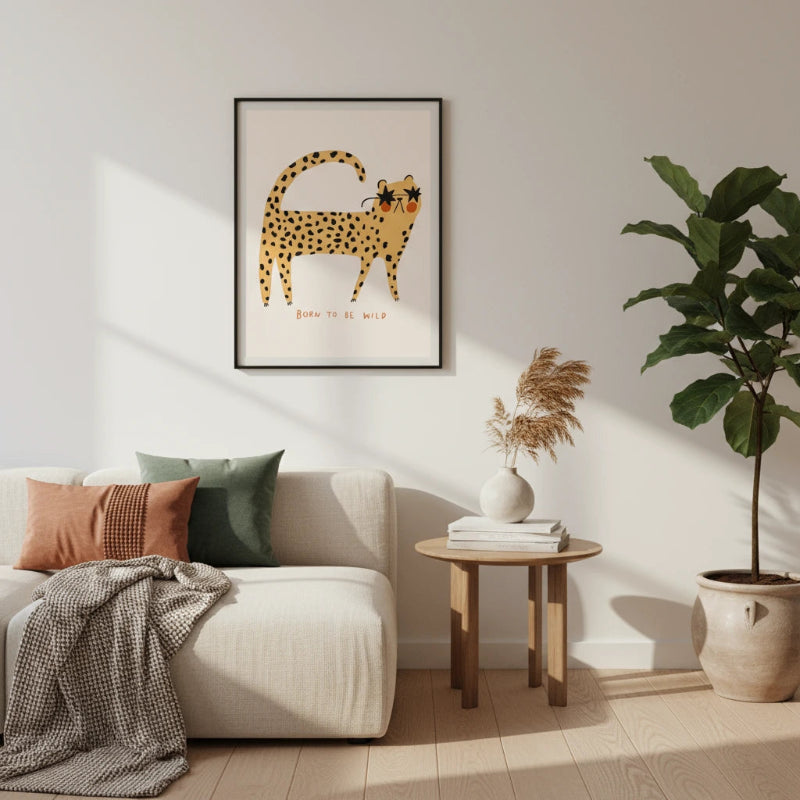Living room with a couch, plant, and wall art