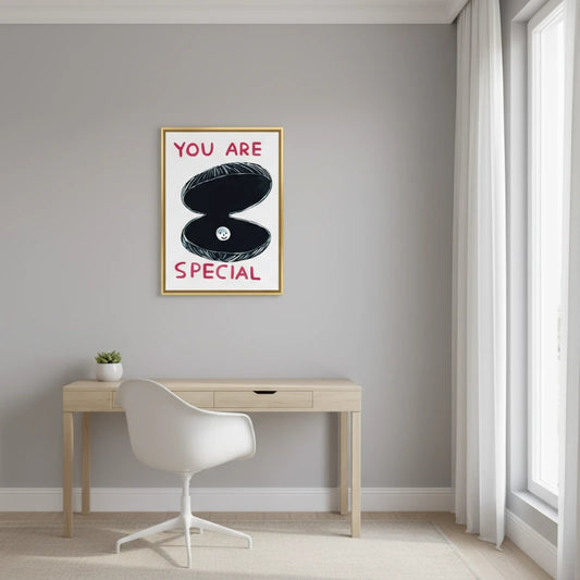Modern interior with a desk and chair, and a motivational poster on the wall. Canvas & Curio