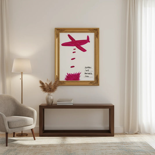 Framed artwork of a pink airplane on a white background in a living room setting. Canvas & Curio